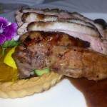 Blood orange glazed Hudson Valley duck breast sweet potato pumpkin custard tartlet, port wine bing cherry reduction